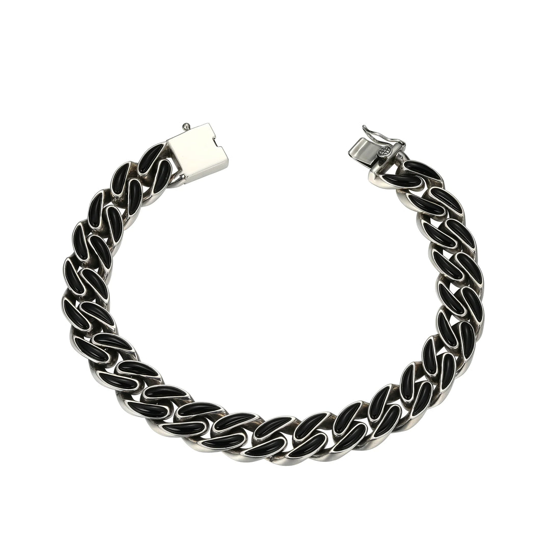Silver chain bracelet with black accents on a white background