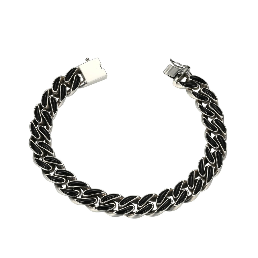 Silver chain bracelet with black accents on a white background