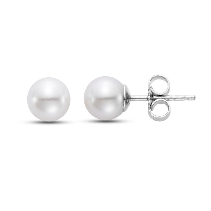 Two pearl earring. One front sided and the other on its side with white gold.