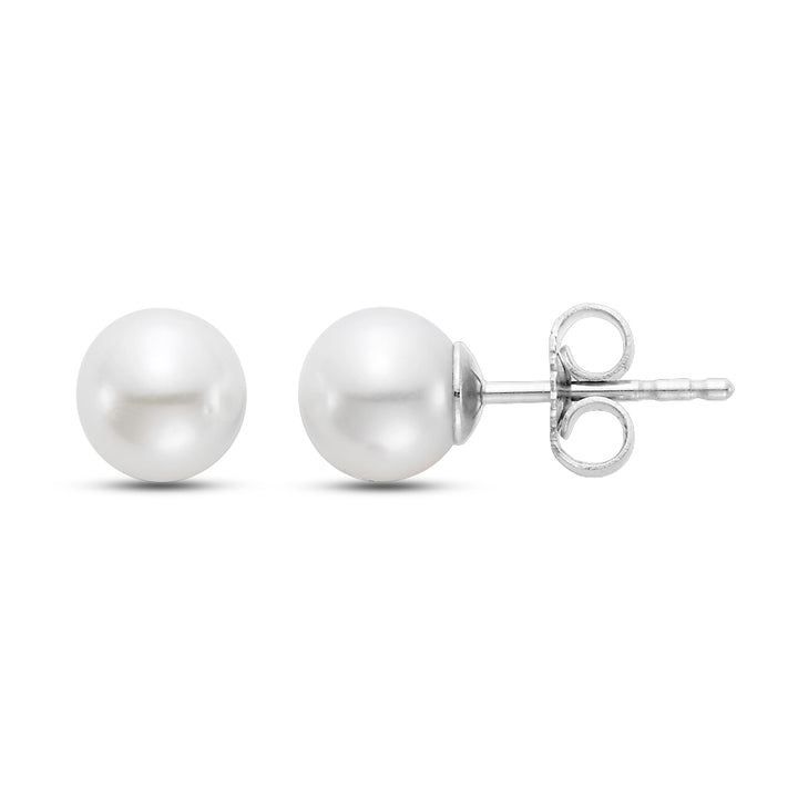 One front sided pearl earring and one on the side, white gold.