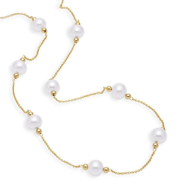 Gold necklace with pearls scattered around the gold chain
