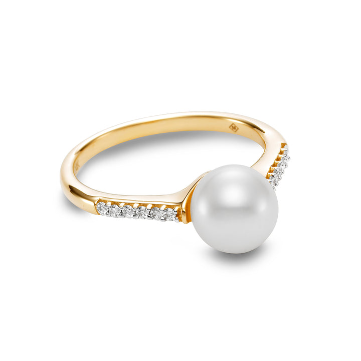 gold ring with a pearl and diamonds on the sides