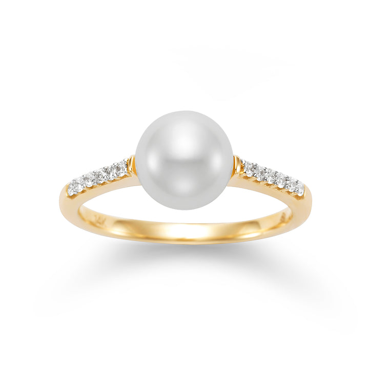 gold ring with a pearl and diamonds on the sides