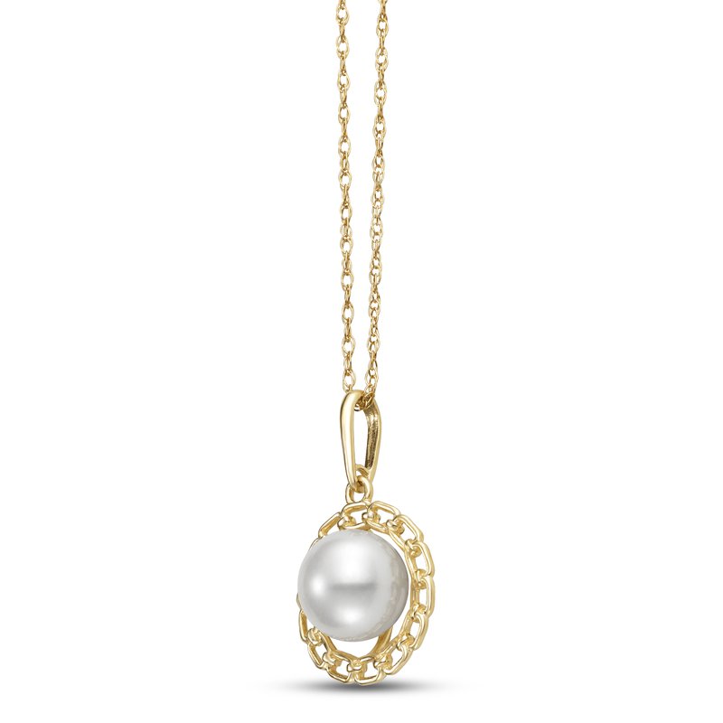 A gold necklace featuring a circular pendant with a central white pearl encased in a decorative gold chain-link border. The chain is a fine, twisted gold link design.