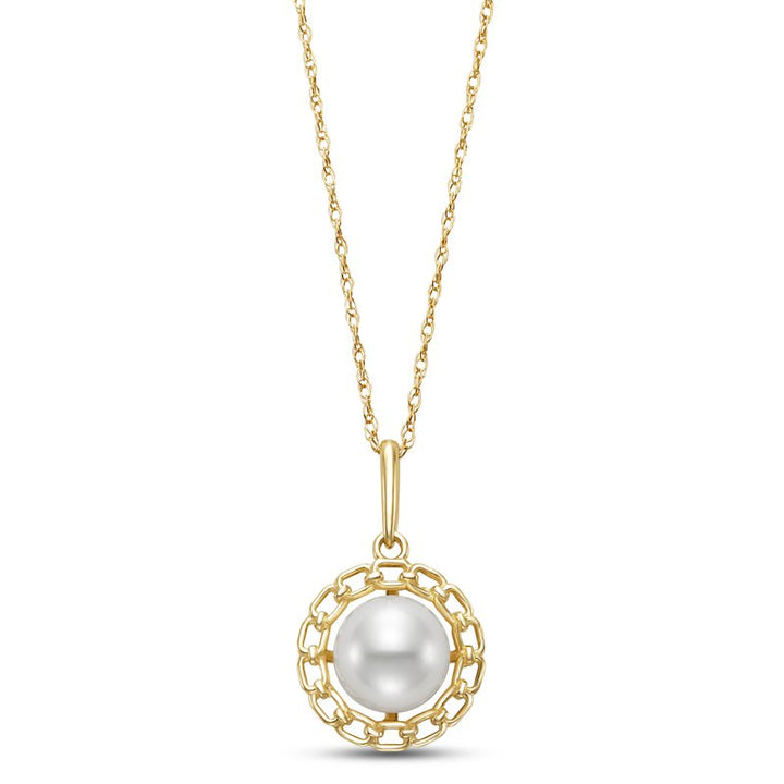 A gold necklace featuring a circular pendant with a central white pearl encased in a decorative gold chain-link border. The chain is a fine, twisted gold link design.