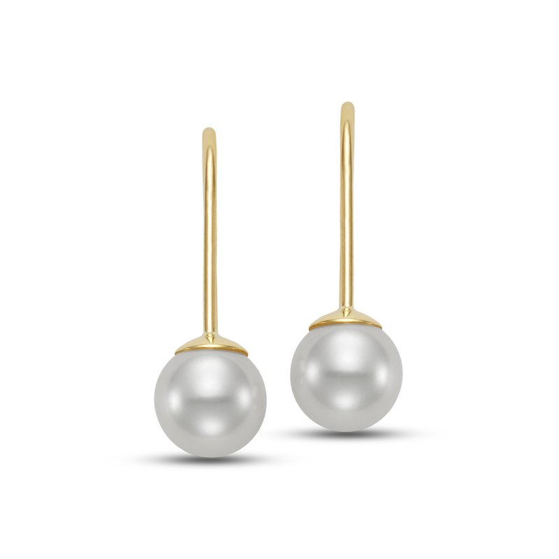 Pair of pearl earrings hanging from a gold hook