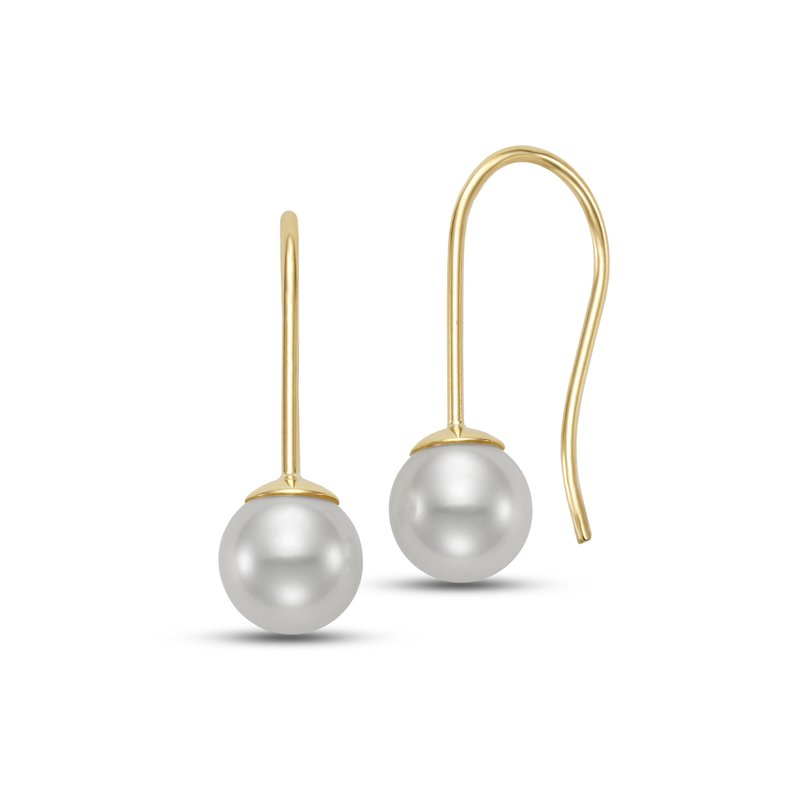 Pair of pearl earrings hanging from a gold hook