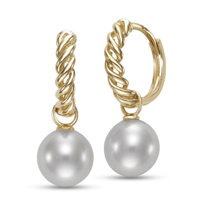 Pair of pearl earrings hanging from a twisted gold hoop