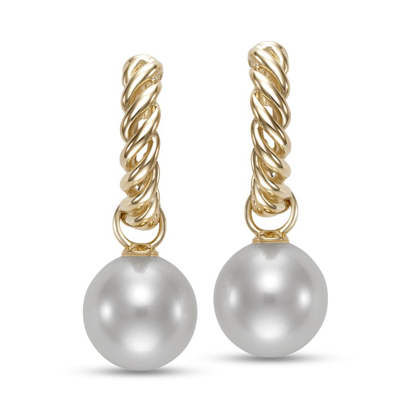 Pair of pearl earrings hanging from a twisted gold hoop