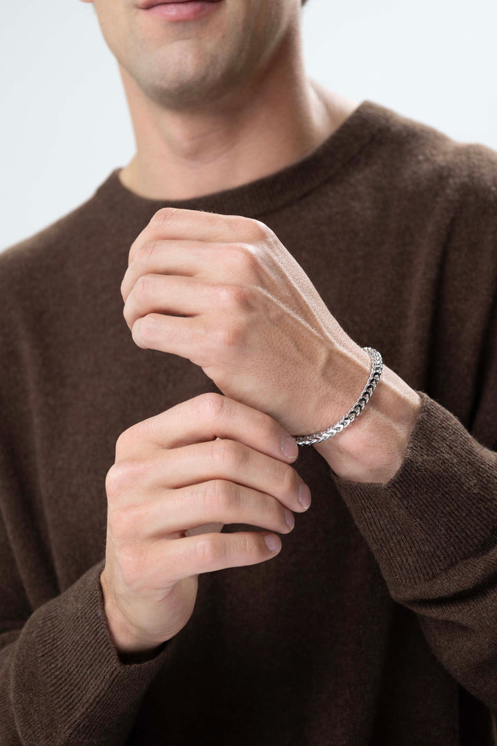 man wearing Italian Chain Rhodium Plated 4-Side Franco Chain Bracelet - 8.5"