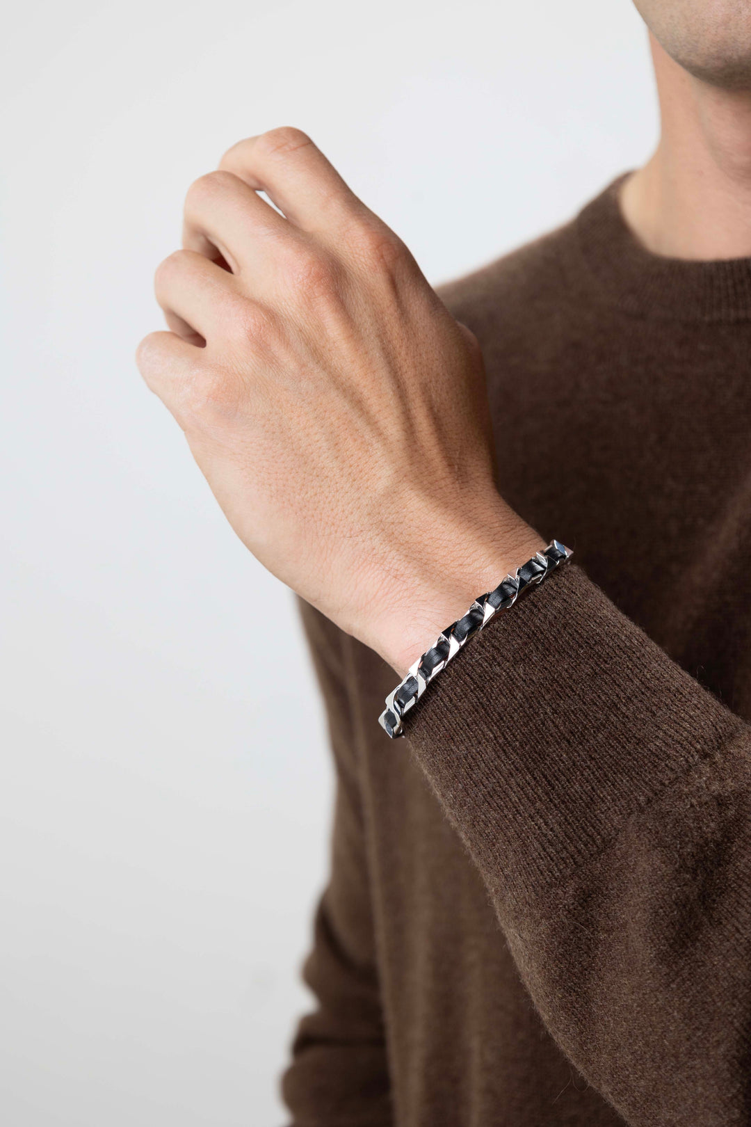 man wearing Italian Chain Rhodium Plated Curb Chain with Black Leather Bracelet
