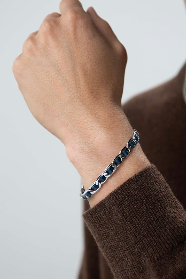 man wearing Italian Chain Rhodium Plated Mariner Chain Bracelet with Blue Flat Leather - 7.75"