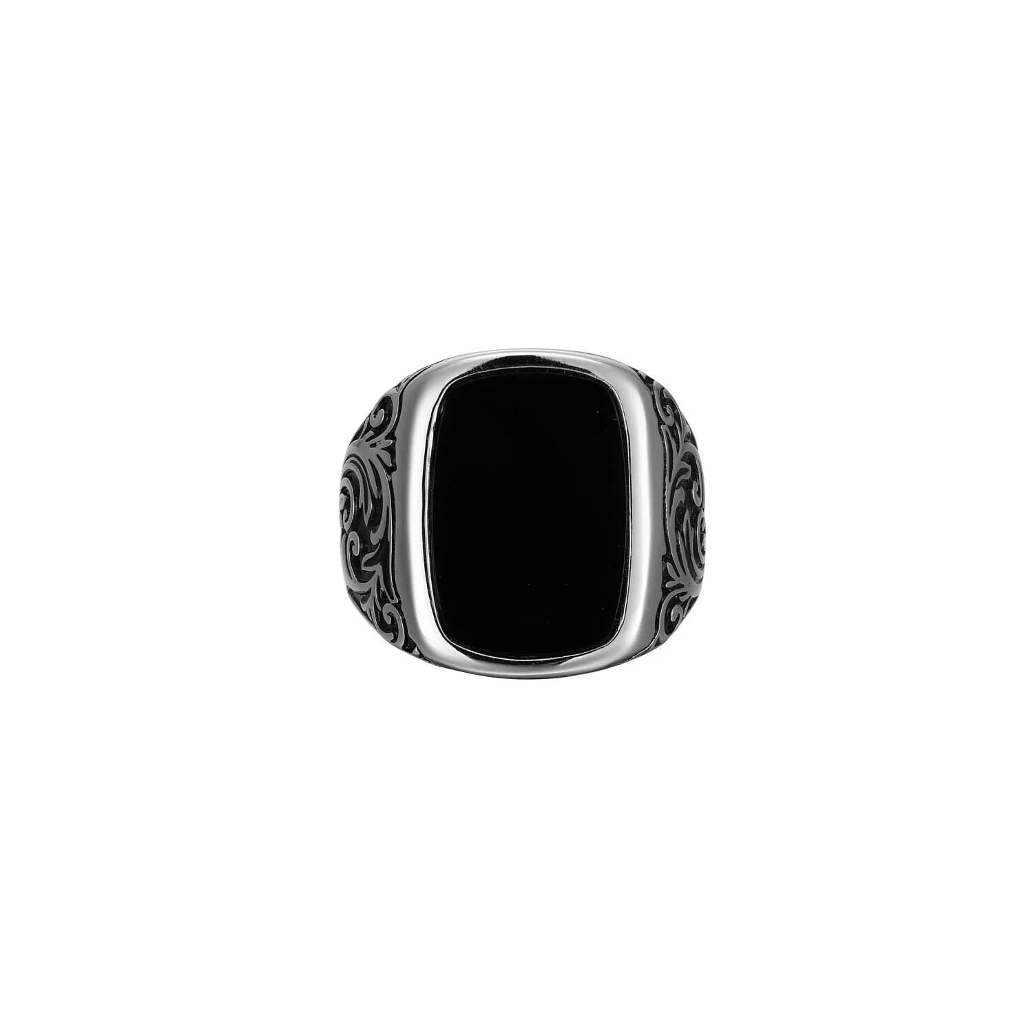 Silver ring with black stone on a white background