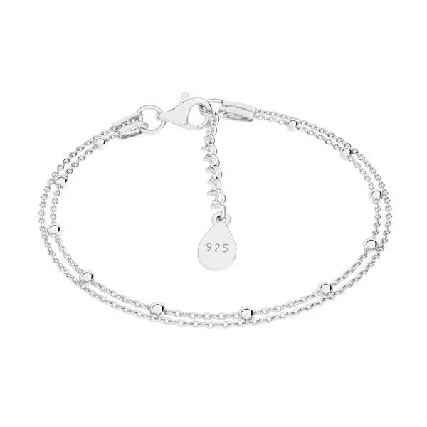 Silver bracelet with a teardrop-shaped charm on a white background