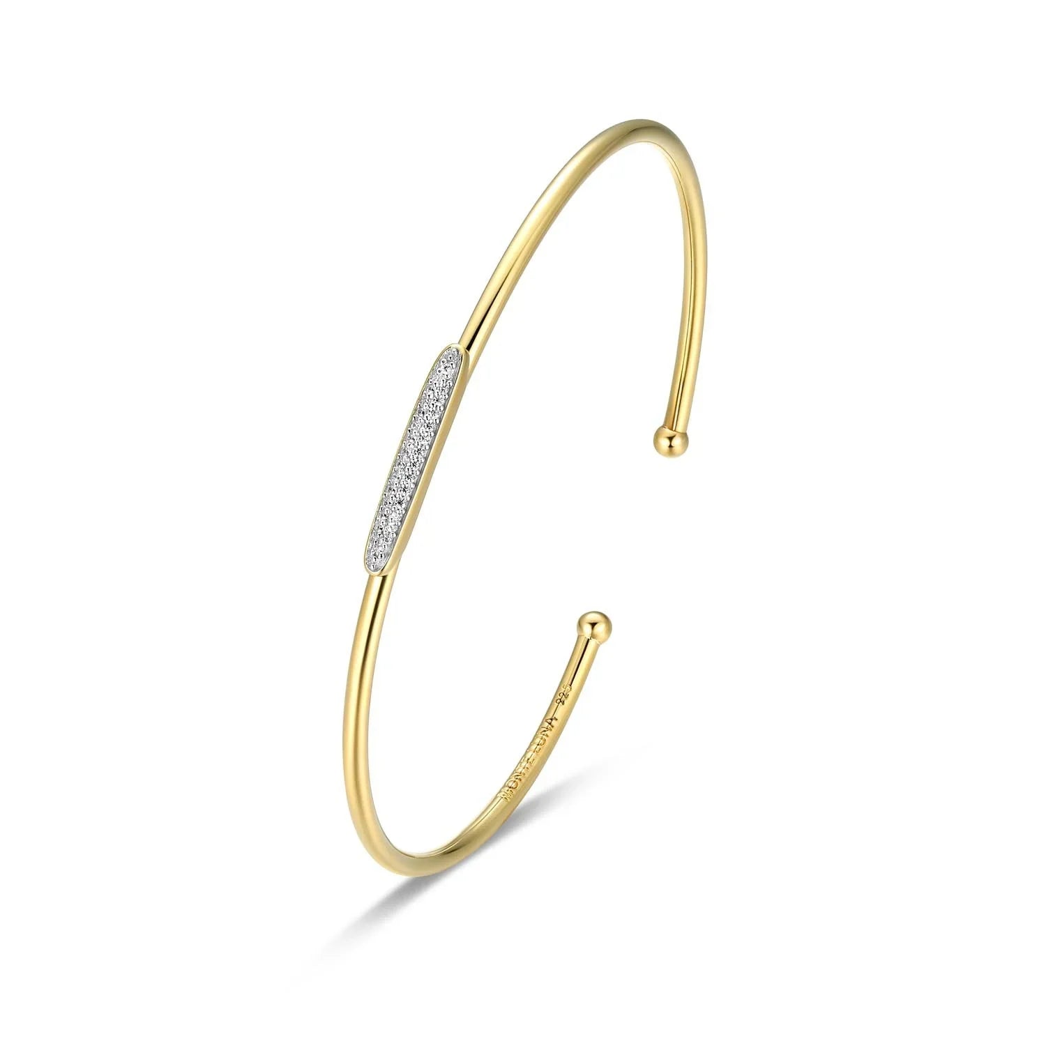 Gold bracelet with diamond accents on a white background