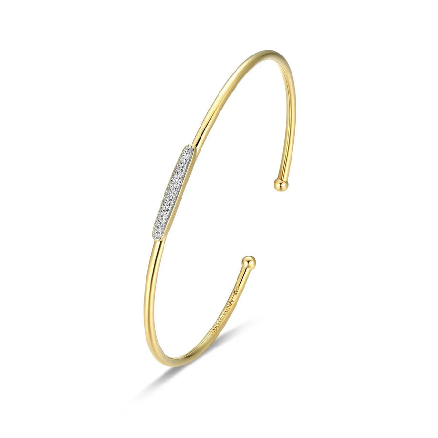 Gold bracelet with diamond accents on a white background