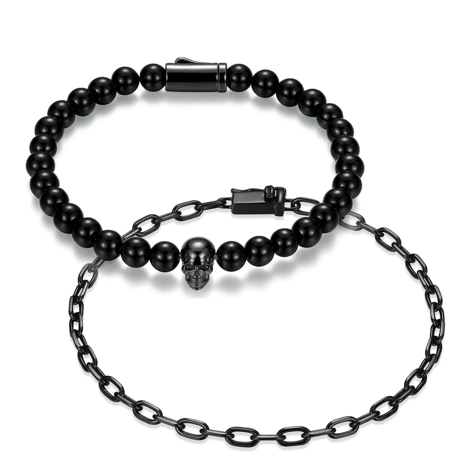 Black beaded bracelet with skull charm and chain on a white background