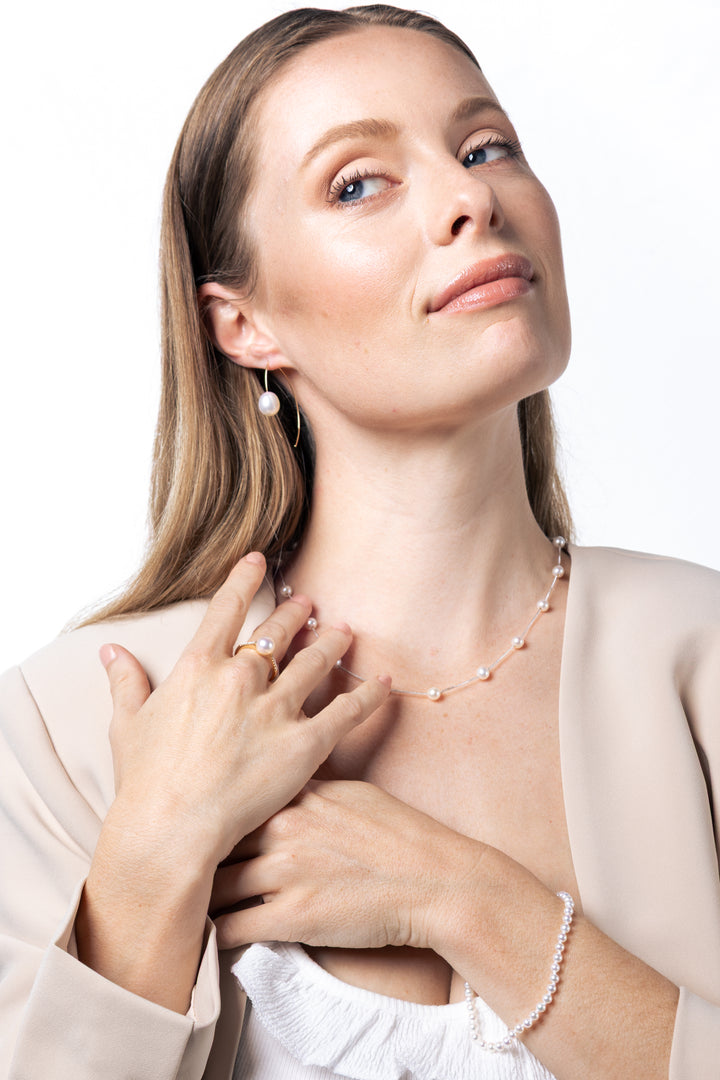 woman wearing 9.5-10mm Freshwater Pearl Earrings in 14K Yellow Gold