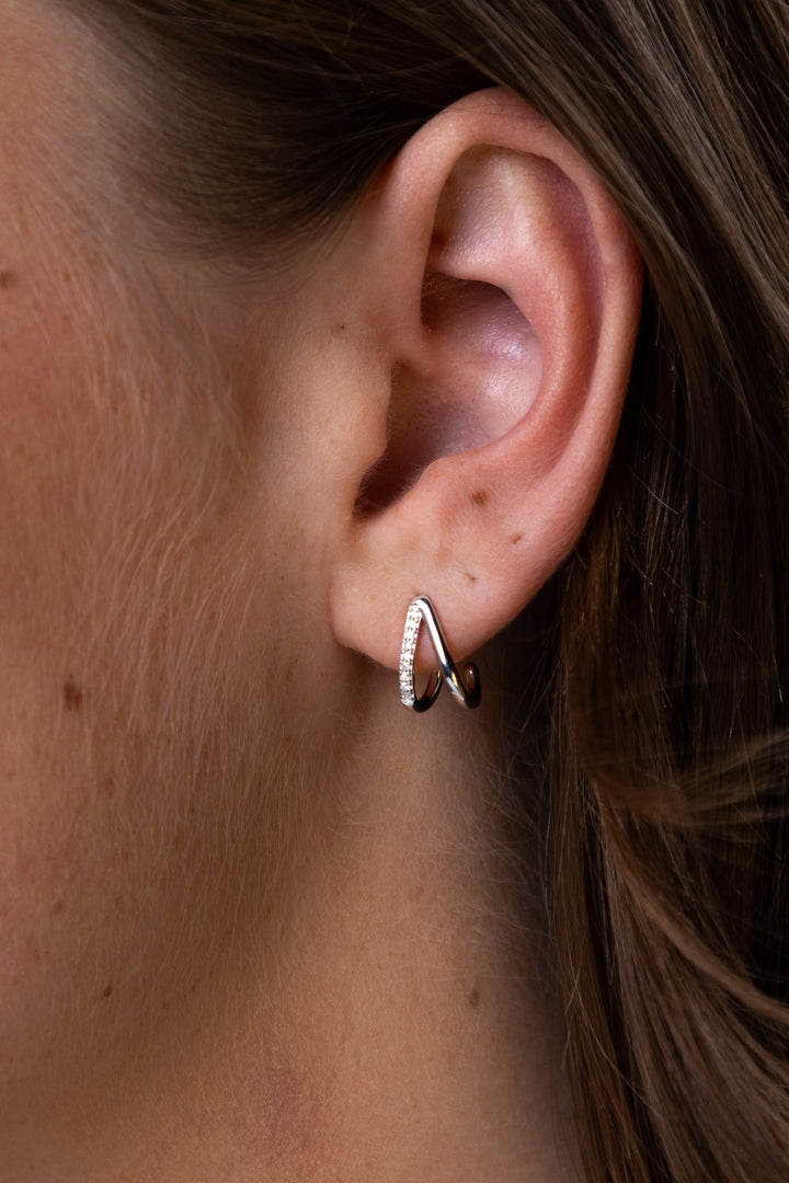 women wearing Silver Split Hoop Lab-Created Diamond Huggie Earrings