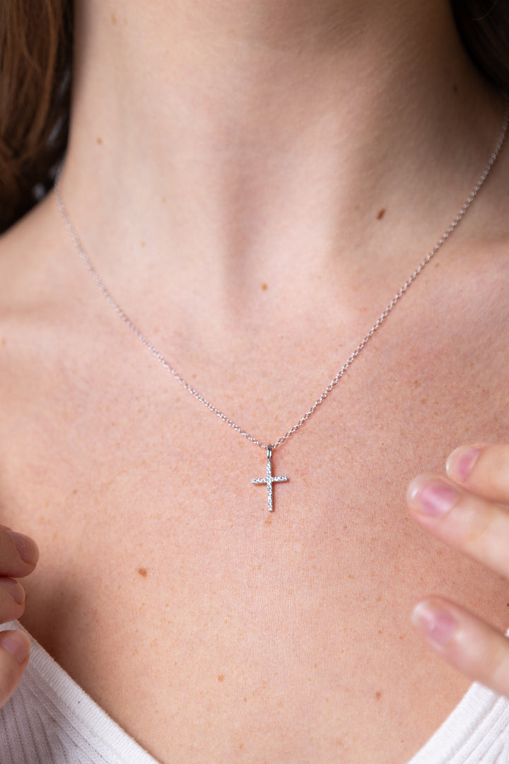 women wearing diamond-white-cross-necklace
