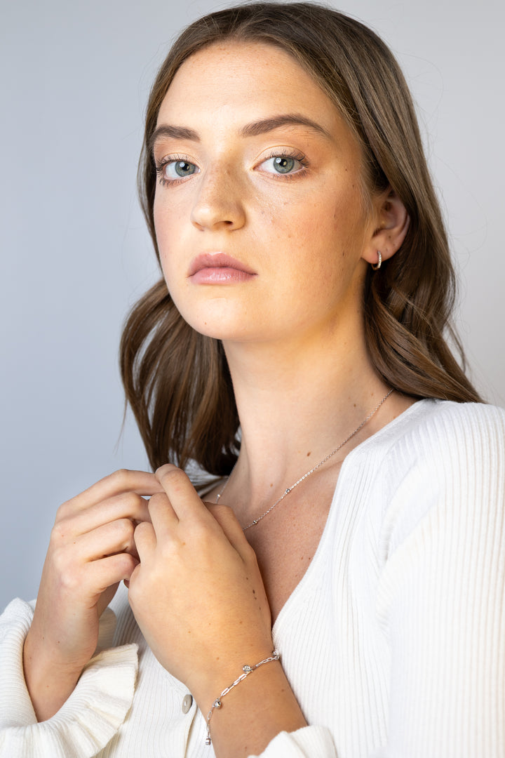 women wearing Silver Bezel-Set Lab-Created Diamond Station Necklace