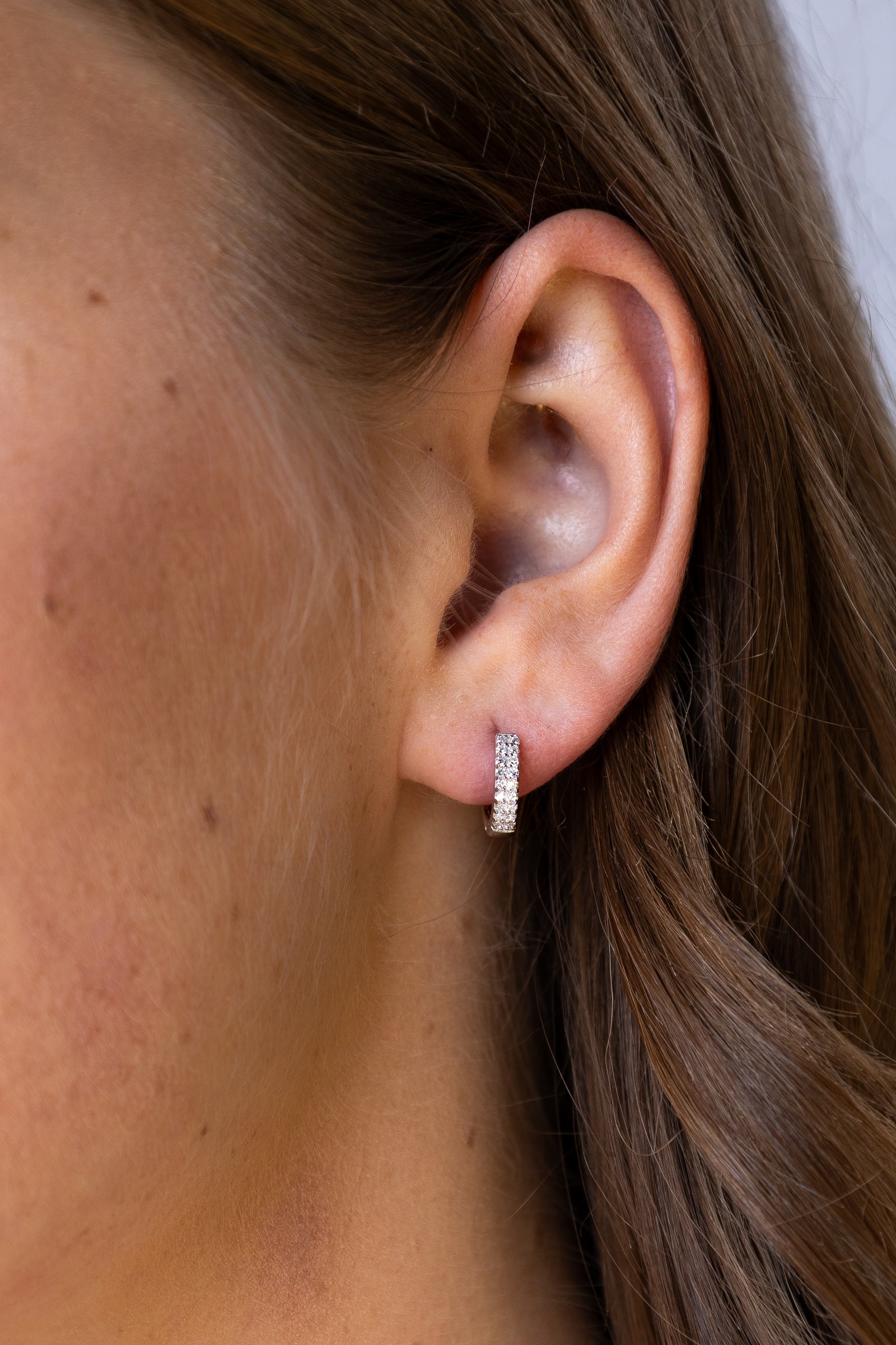 women wearing Silver Petite Double Row Hoop Earrings