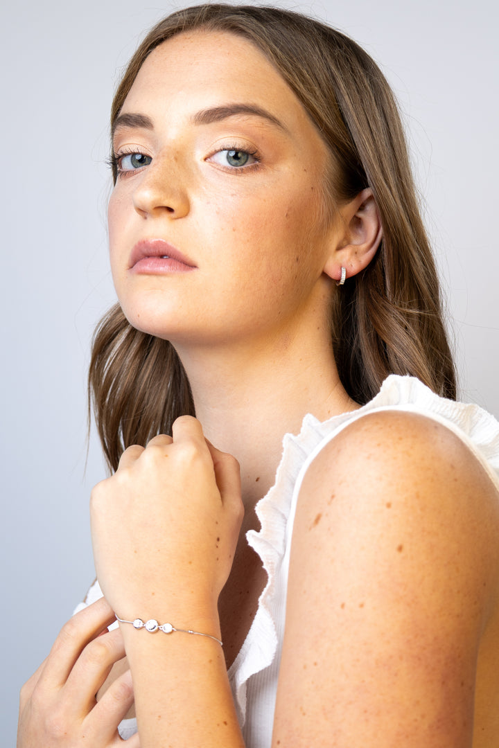 women wearing diamond-white-three-bracelet