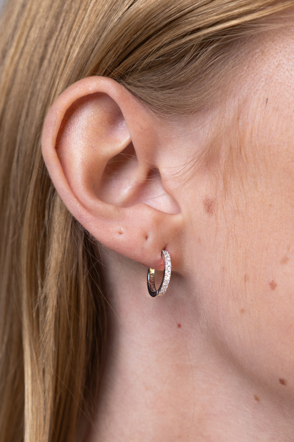 woman wearing Silver Petite Hoop Earrings
