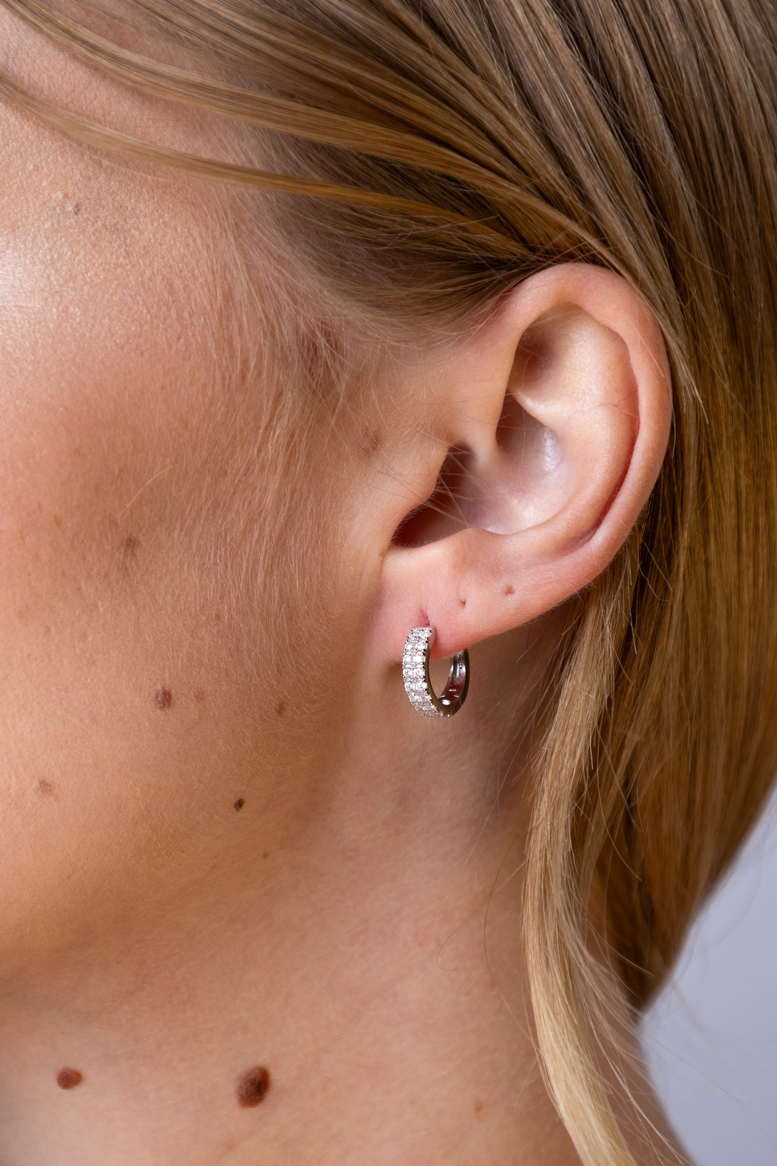woman wearing Silver Double Row Hoop Earrings