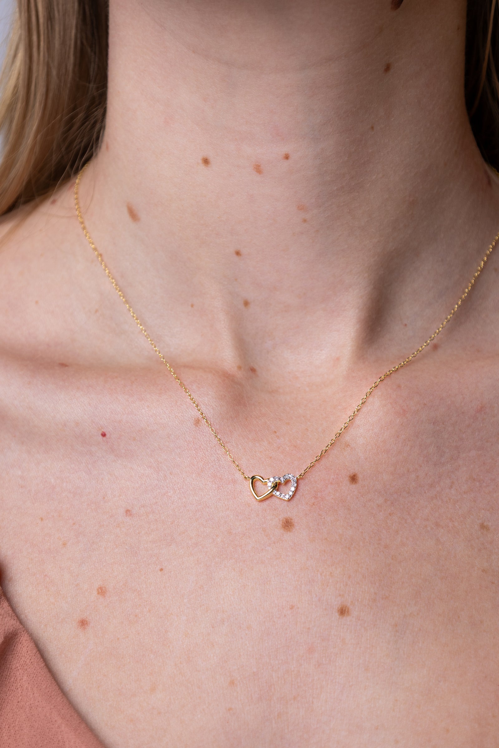 women wearing diamond-double-hearts-yellow-necklace