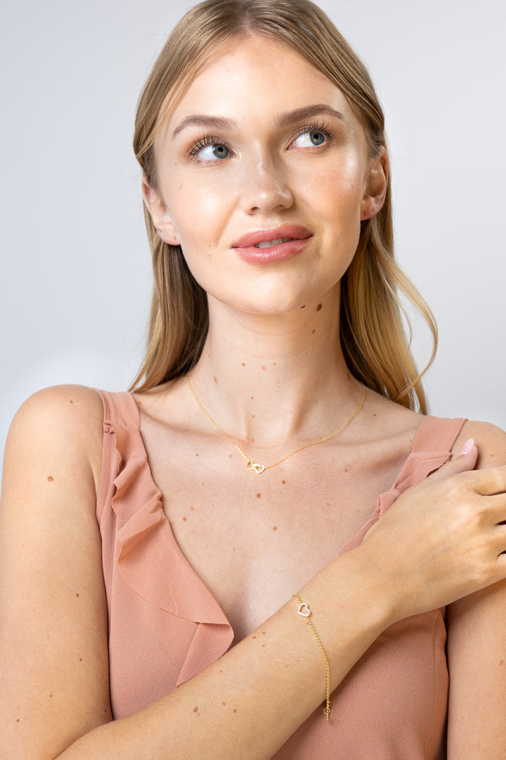 women wearing diamond-double-hearts-yellow-necklace