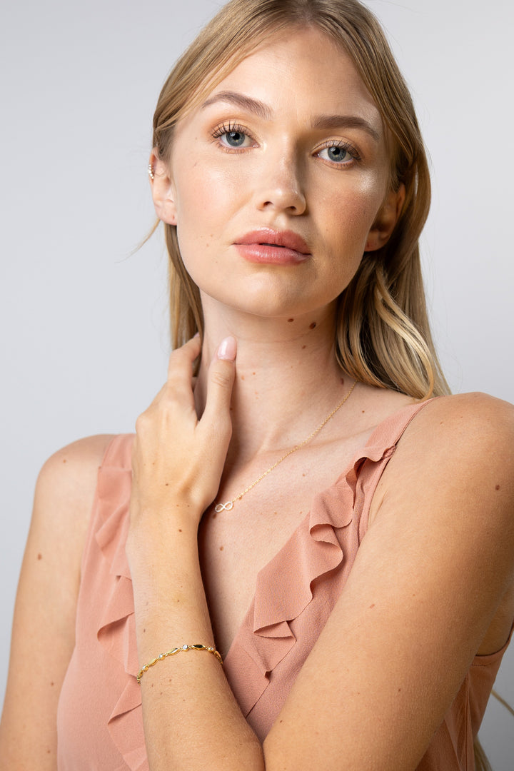 woman wearing diamond-yellow-leaves-bracelet