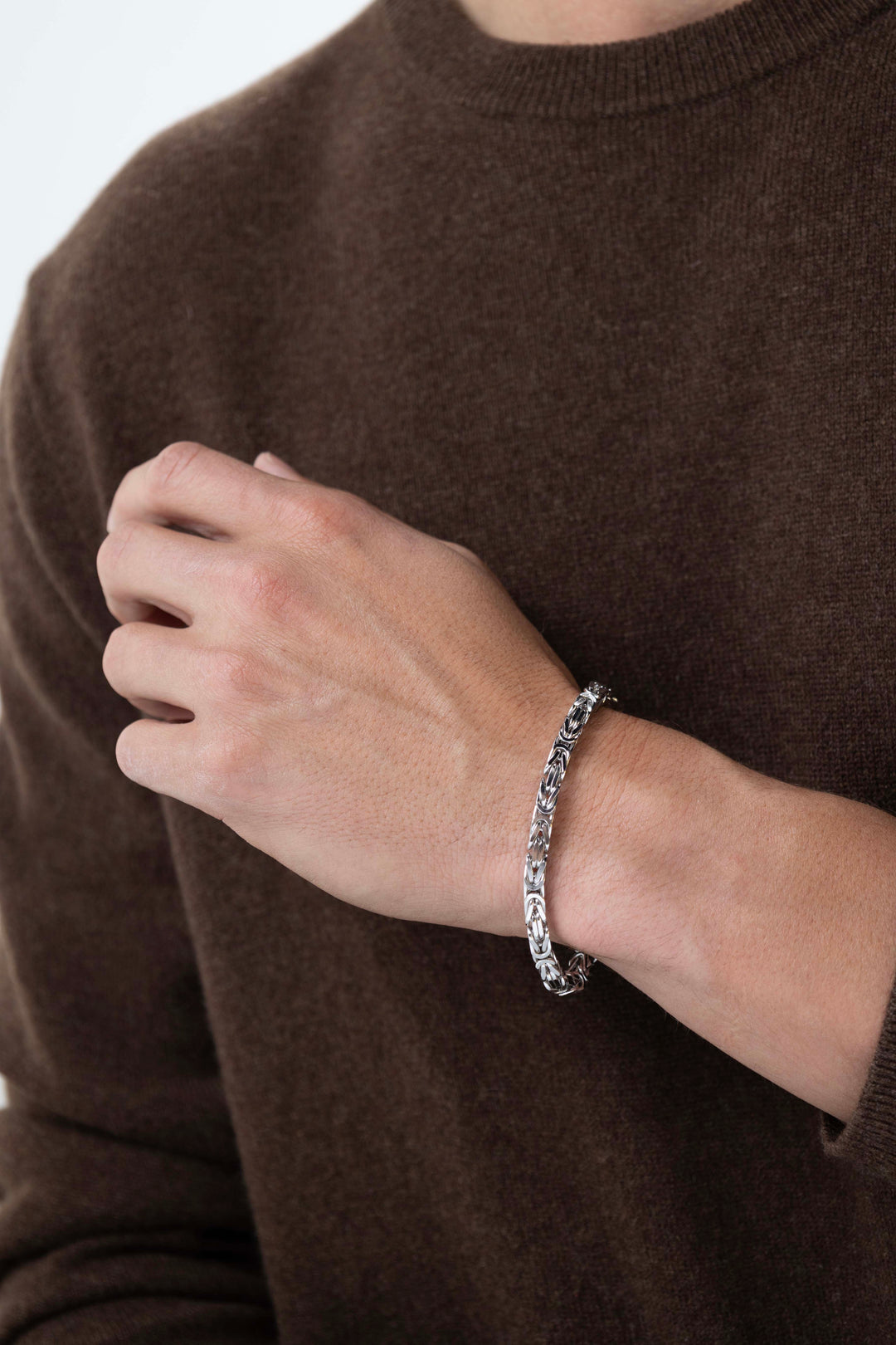 Man wearing Italian Chain Rhodium Plated Byzantine Chain Bracelet - 7.75"