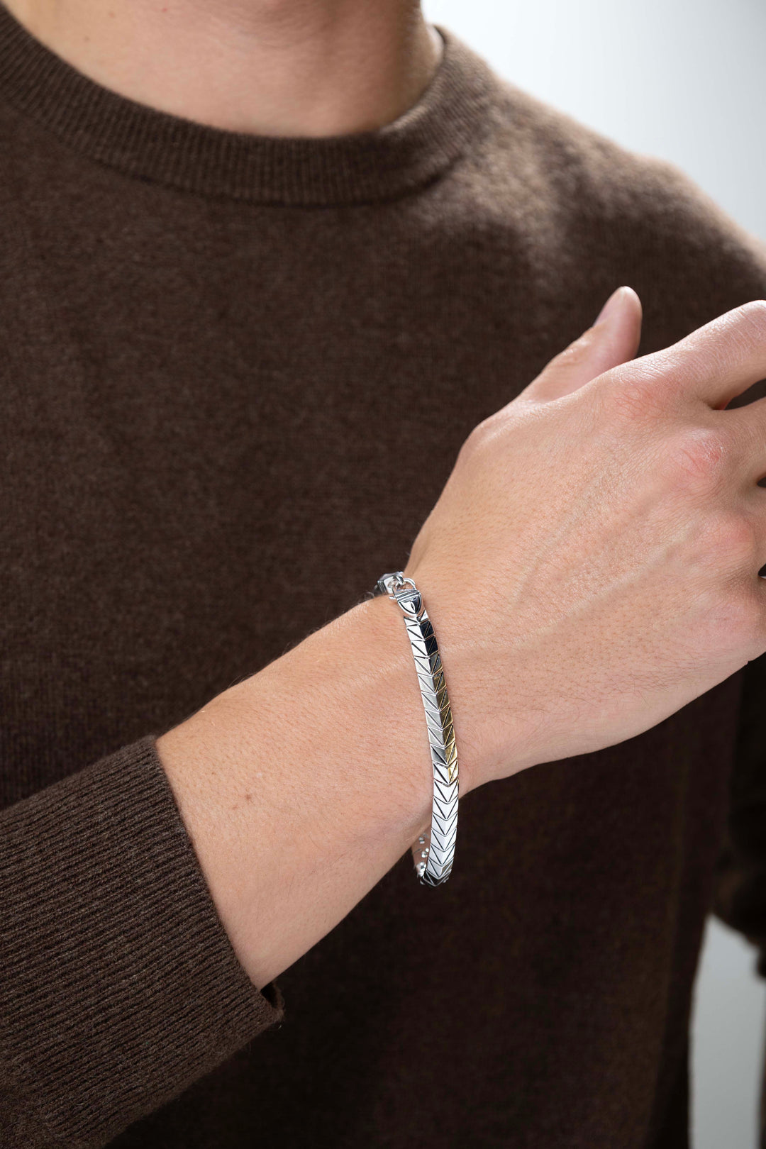Man wearing Chevron Rhodium Plated Sterling Silver Arrowhead Link Bracelet