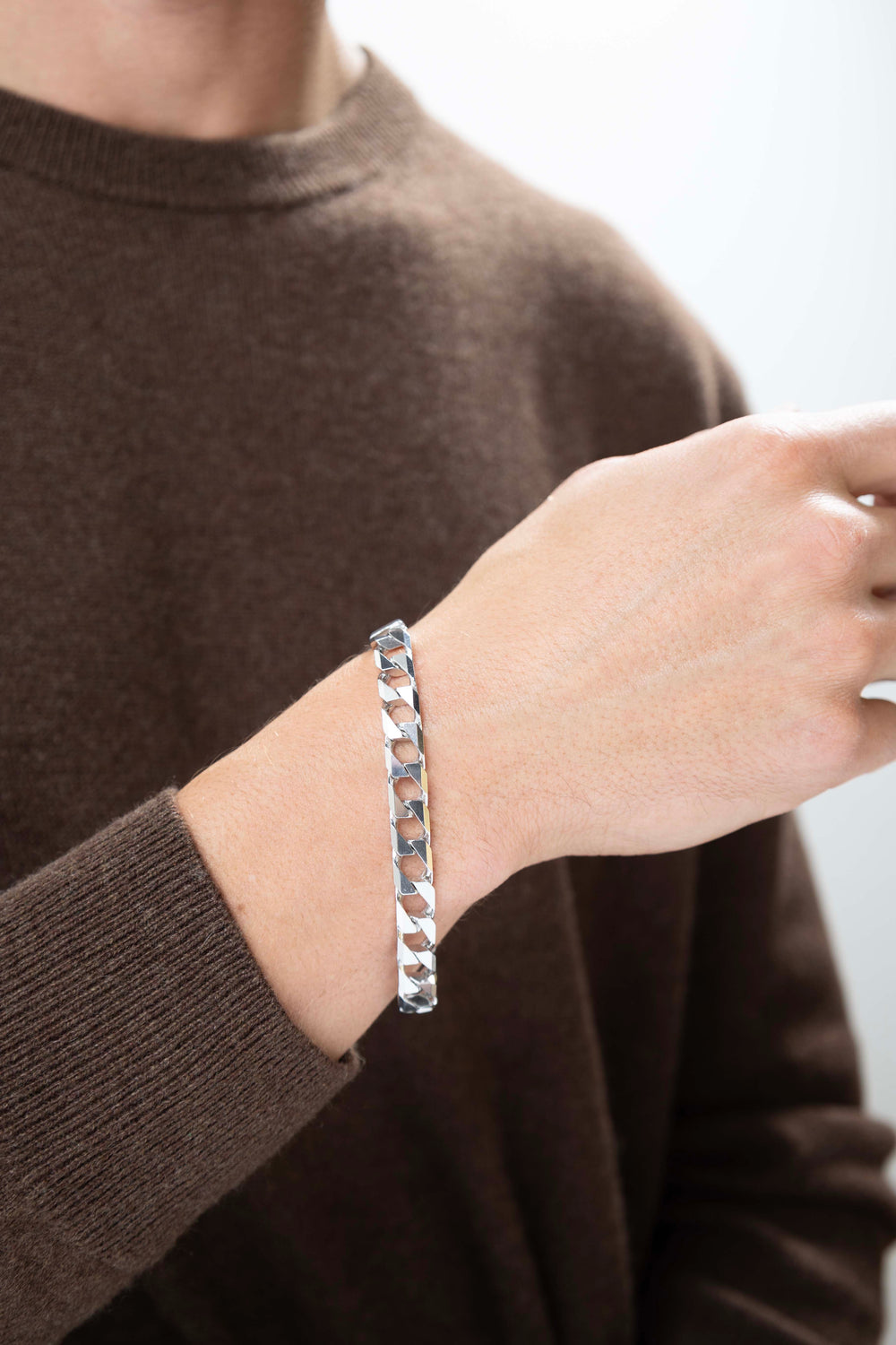 man wearing Italian Chain Rhodium Plated Square Curb Bracelet - 8.5"